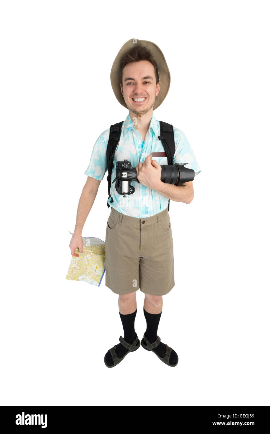 Happy man tourist in blue shirt, brown shorts and hat with backpack on his shoulders holding dslr camera and map. Traveler smili Stock Photo