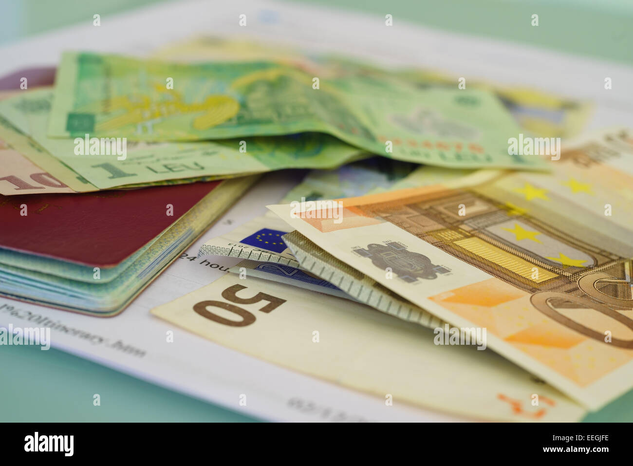 Travel documents, passport, foreign money (Euro and Romanian Leu) and flight itinerary for travelling. Stock Photo