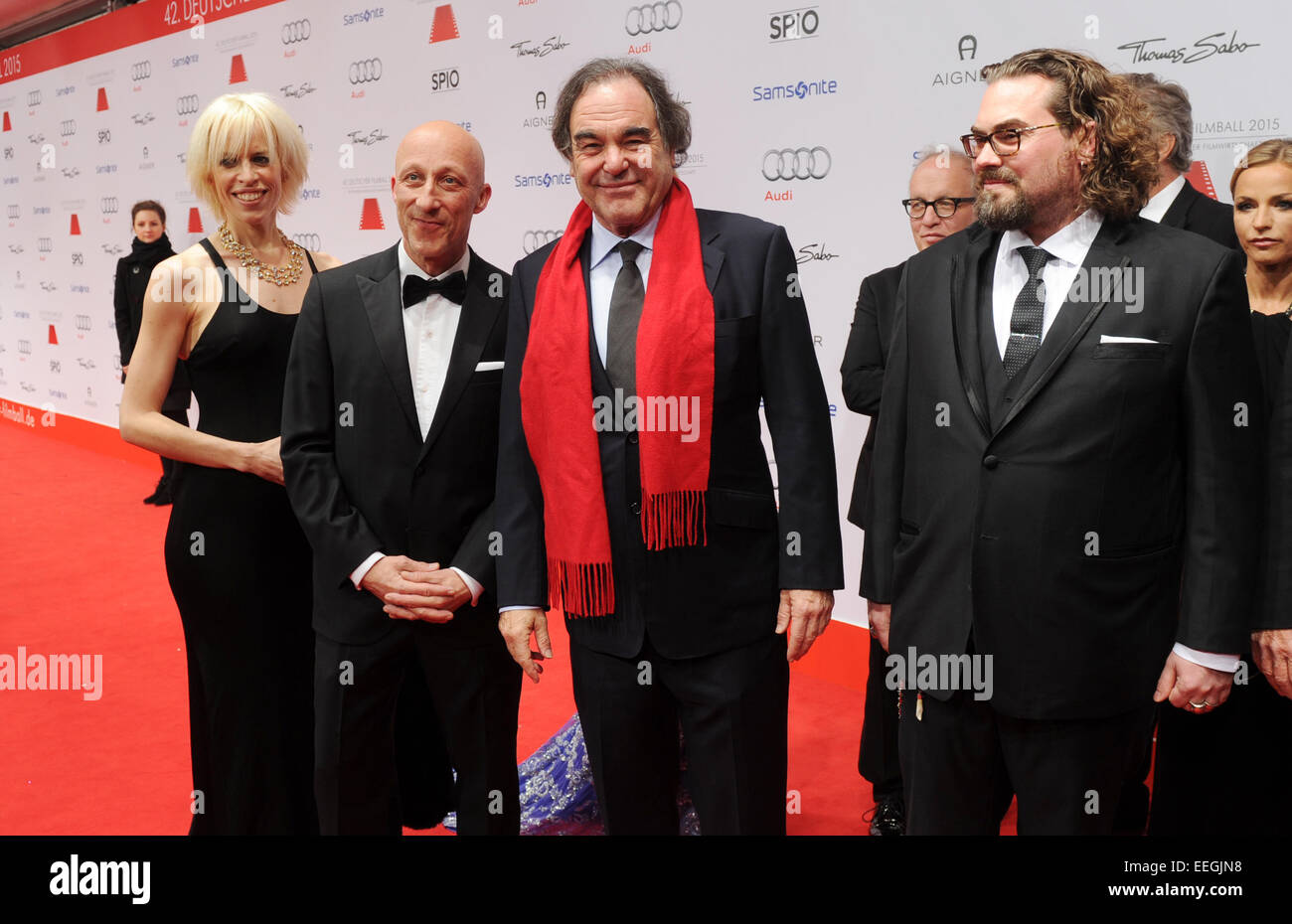 Munich, Germany. 17th Jan, 2015. Katja Eichinger (L-R), movie director Oliver Hirschbiegel, US movie director Oliver Stone and producer Philip Schulz-Deyle arrive at the 42th German Film Ball at the Hotel Bayerischer Hof in Munich, Germany, 17 January 2015. PHOTO: Tobias Hase/dpa/Alamy Live News Stock Photo