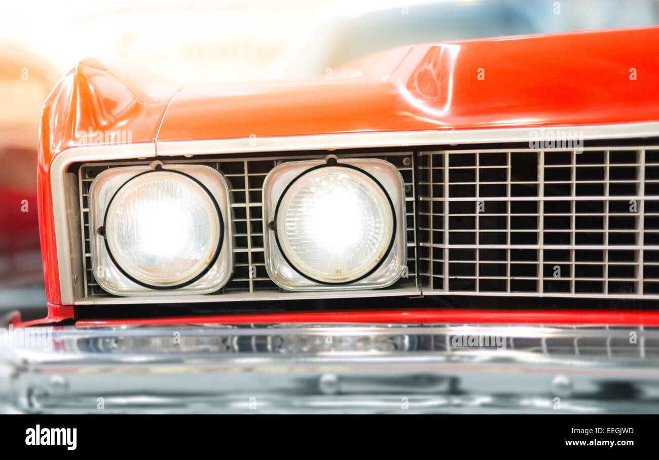 Close Up Detail of Headlight of Shiny Red Classic Car Stock Photo - Alamy