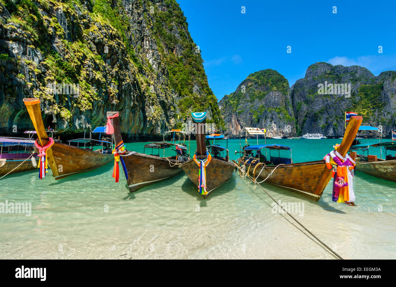 Maya Bay is a stunningly beautiful bay that's sheltered by 100-metre high cliffs on three sides with several beaches with soft w Stock Photo