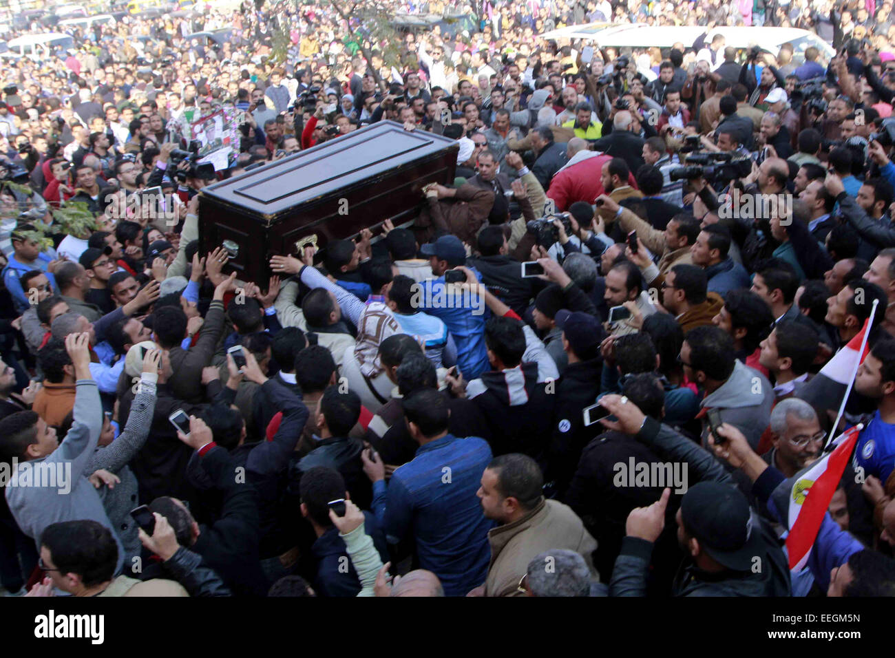 Cairo, Egypt. 18th Jan, 2015. Mourners carry the coffin of Egyptian actress Faten Hamama during her funeral in 6th of October City on the outskirts of Cairo on January 18, 2015. Hamama, an Arab film icon and Omar Sharif's former wife, died on January 17, 2015 at the age of 83, their son Tarek Sharif said. Hamama, who was less than 10 when she made her screen debut, appeared in almost 100 films and worked with masters of Egypt's massive film industry, including Youssef Chahine Credit:  Amr Sayed/APA Images/ZUMA Wire/Alamy Live News Stock Photo