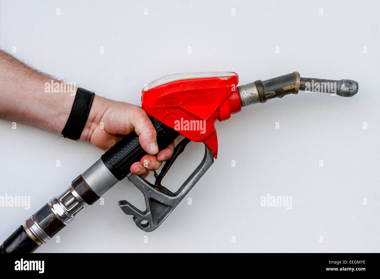 man holding gas pump nozzle Stock Photo Alamy