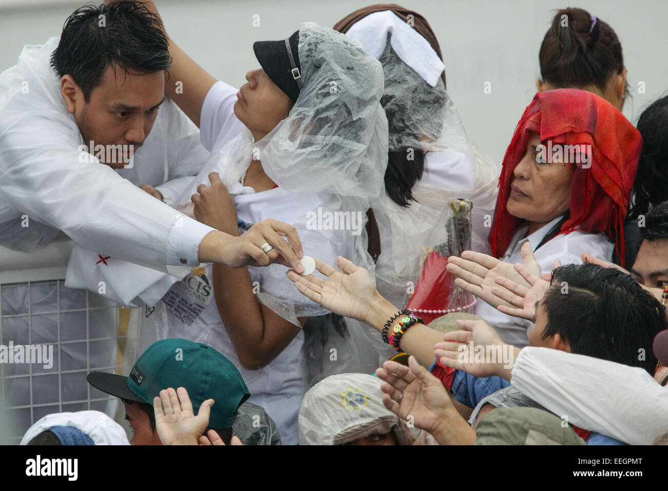 Manila, Philippines. 18th Jan, 2018. The crowd reachout their hands to get communion during Pope Francis' closing mass at the uirino Grandstand, Rizal Park on January 18, 2015. The mass was attended by an estimate of 6-7 million people. Photo by Mark Cristino. Credit:  Mark Fredesjed Cristino/Alamy Live News Stock Photo