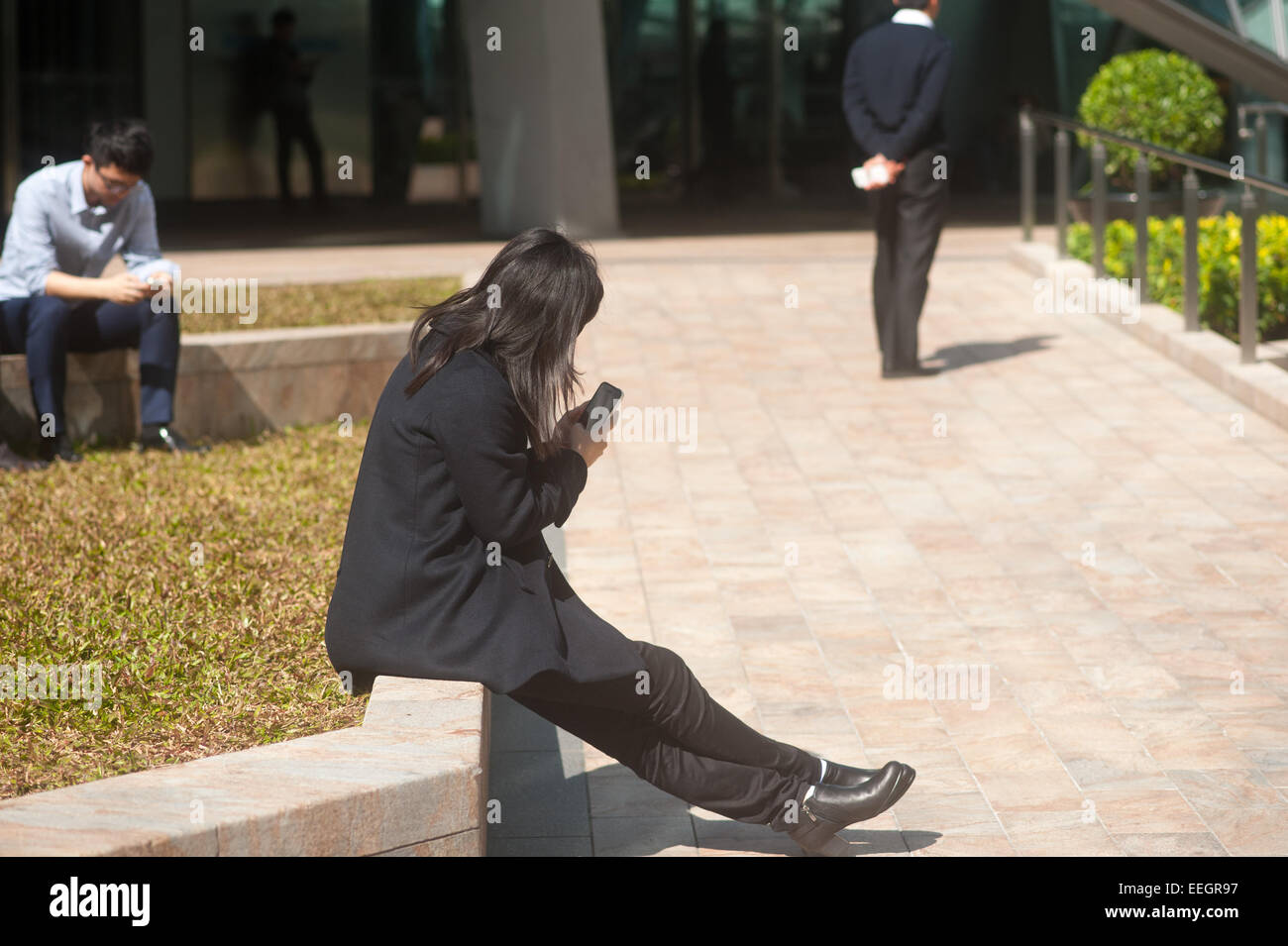 Hong Kong Business woman on her phone. Stock Photo
