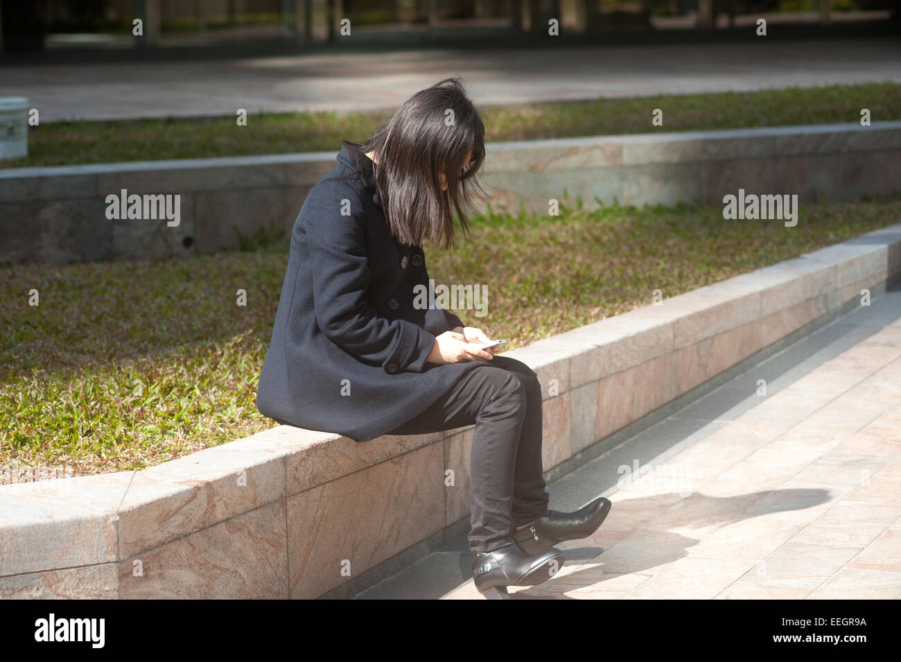 Hong Kong Business woman on her phone. Stock Photo