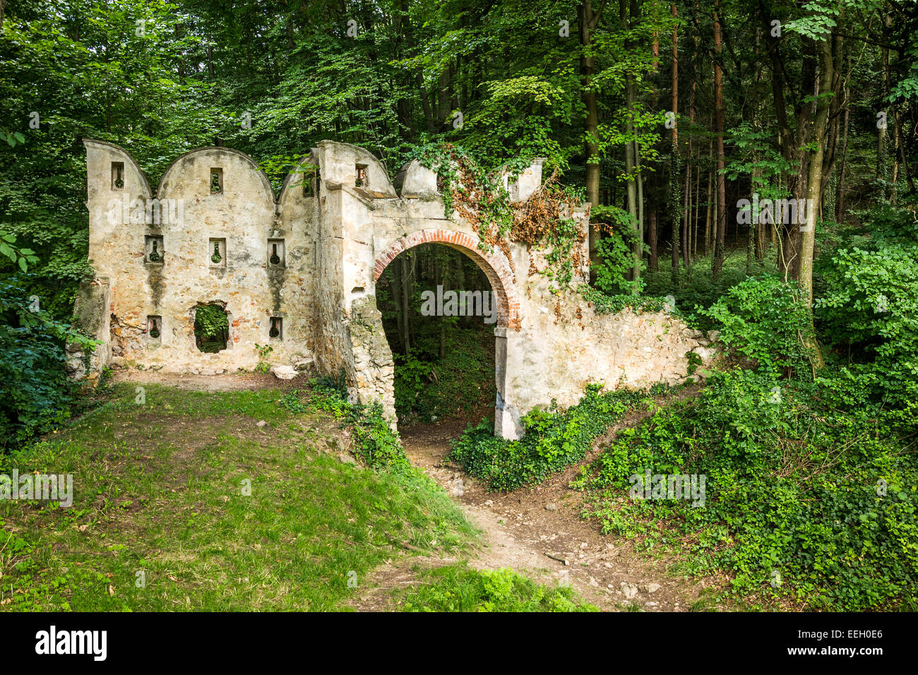 Ancient Gate Ruins on the Forest Edge Stock Photo