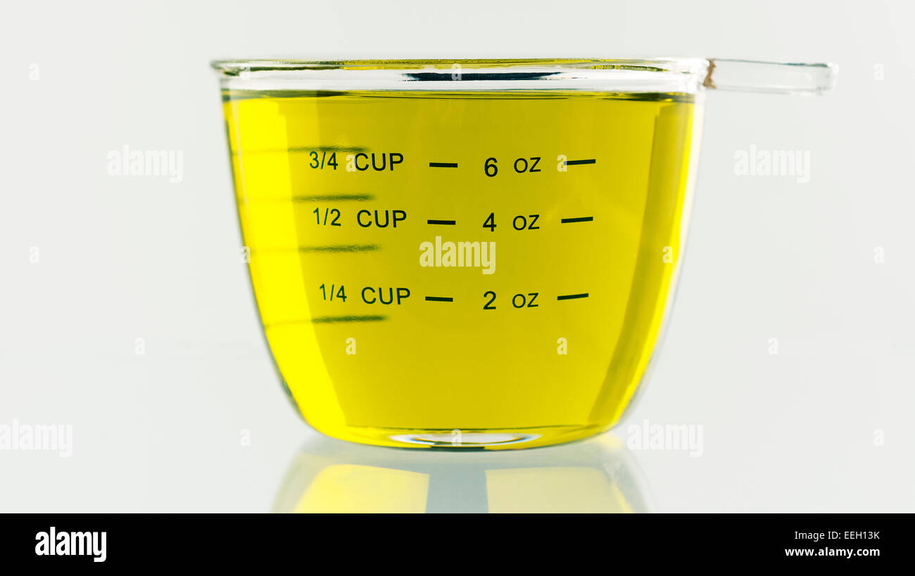 Olive Oil Measured Out In A 250 Ml Or 8 Ounce Glass Measuring Cup Stock 