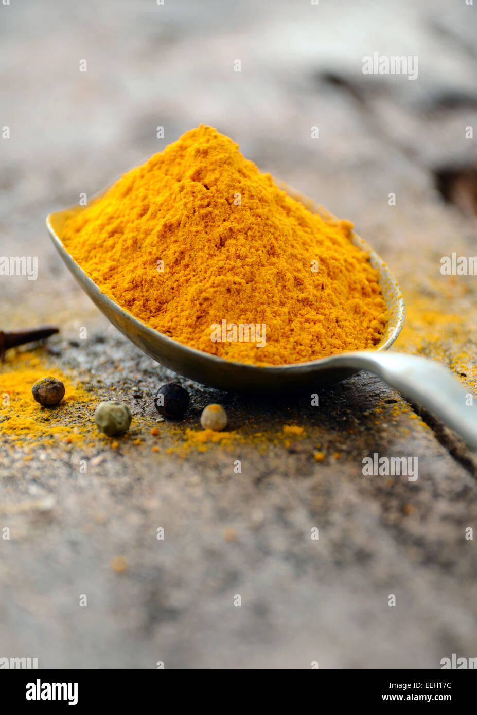 Ground turmeric in a spoon Stock Photo Alamy