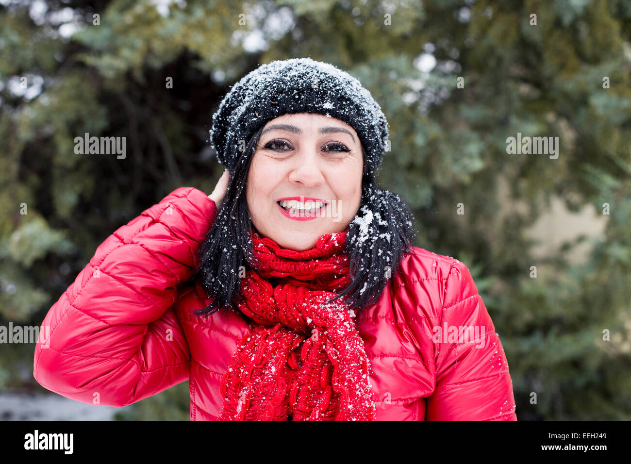 Black-haired Turkish women posing on a snowy day Stock Photo