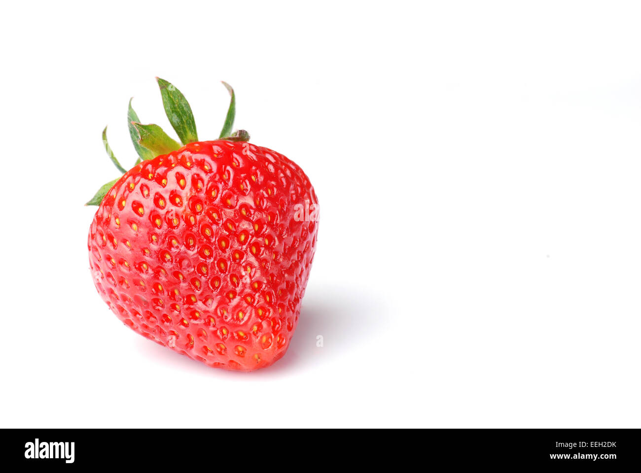 single fresh red strawberry on white background Stock Photo - Alamy