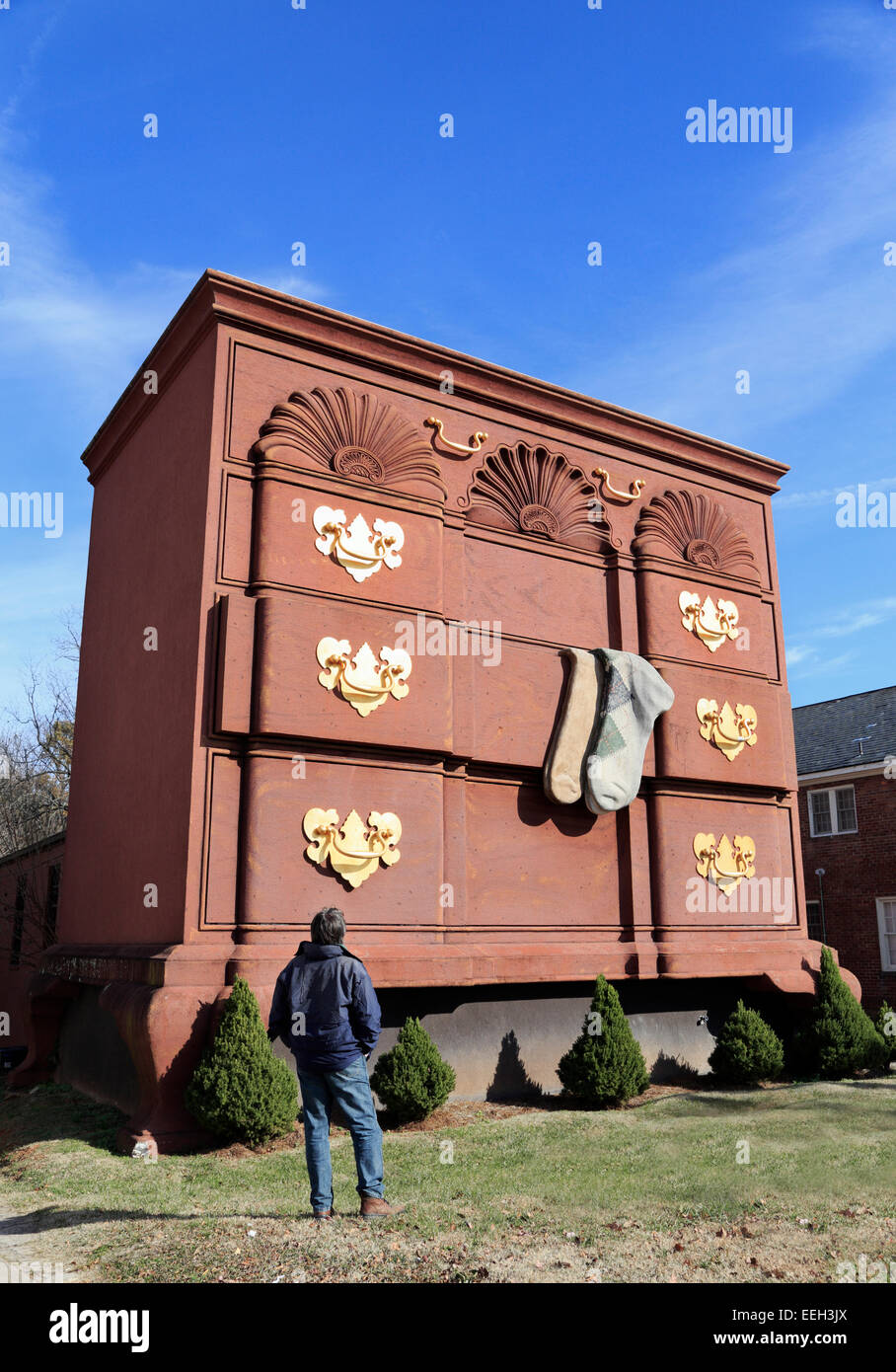 High point, Highpoint, North Carolina. Man looking at giant Chippendale bureau. Stock Photo