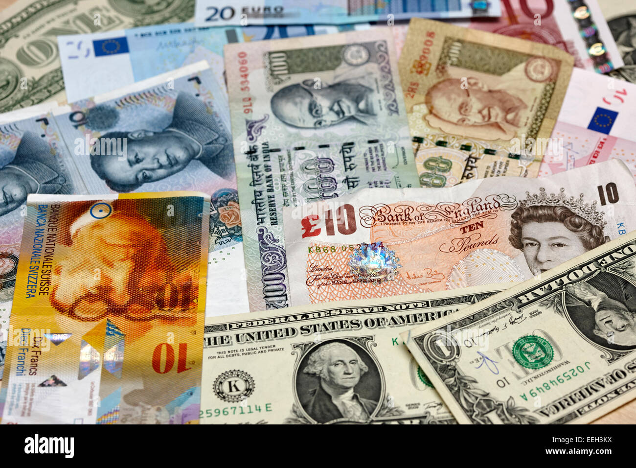 various world currencies euro, us dollars, chinese yuan, indian rupees, pounds sterling and swiss francs Stock Photo