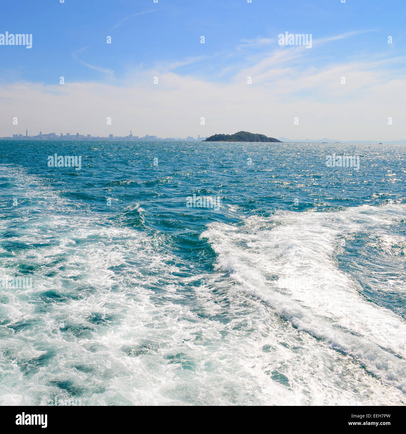 The wake of a boat as seen from the stern of a ship at Coast of Pattaya city, Thailand Stock Photo