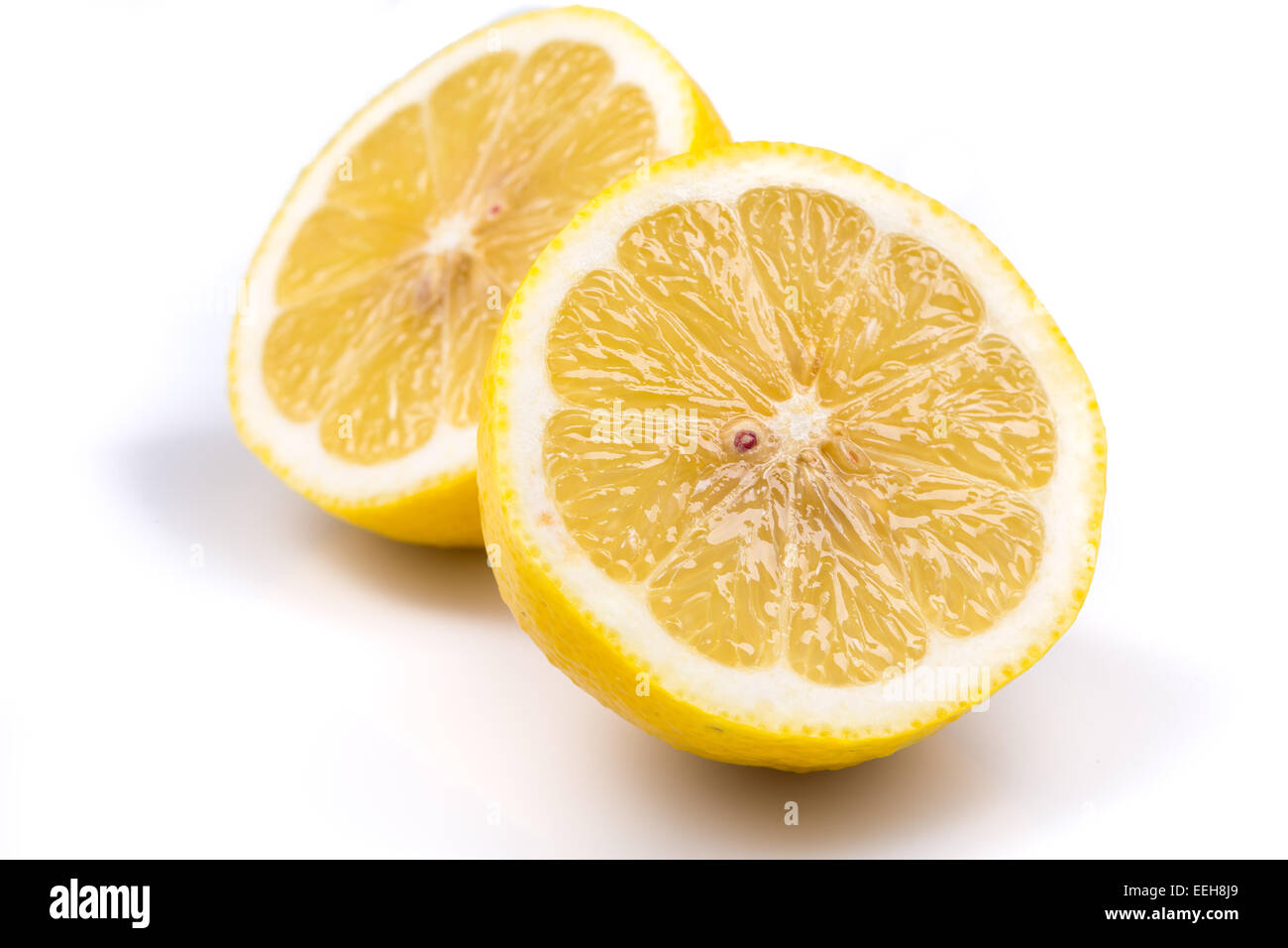 Two lemon slices on a white background Stock Photo - Alamy