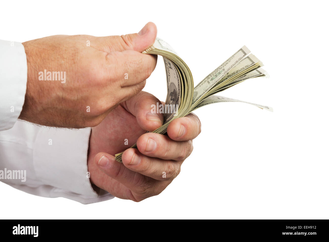 Hands of businessman holding and counting money isolated on white background.Selective focus. Stock Photo
