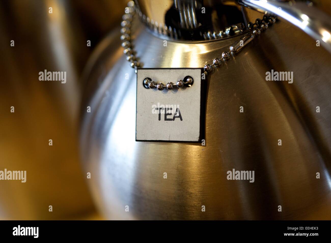 tea sign on silver tea holder Stock Photo Alamy