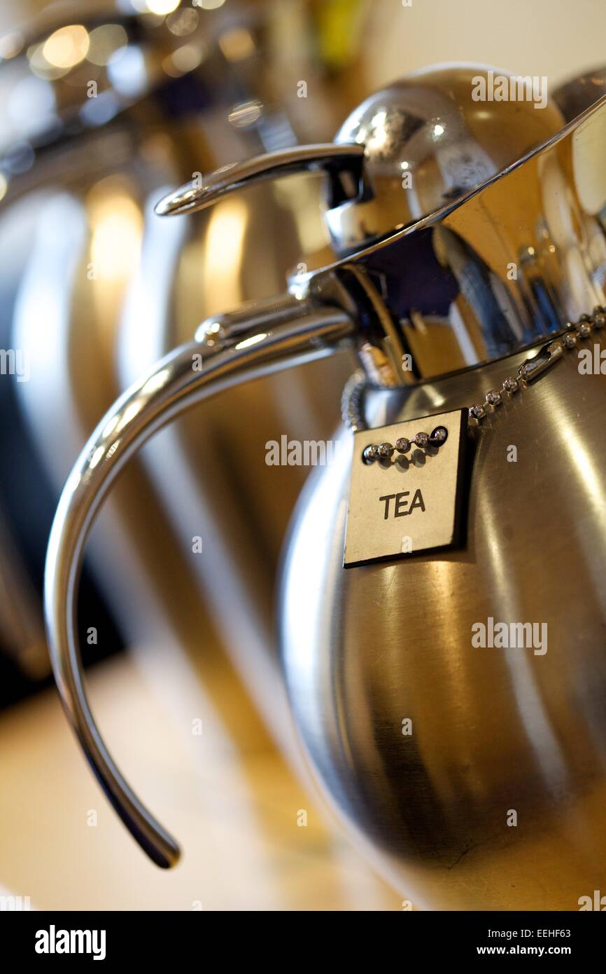 tea sign on silver tea holder Stock Photo Alamy