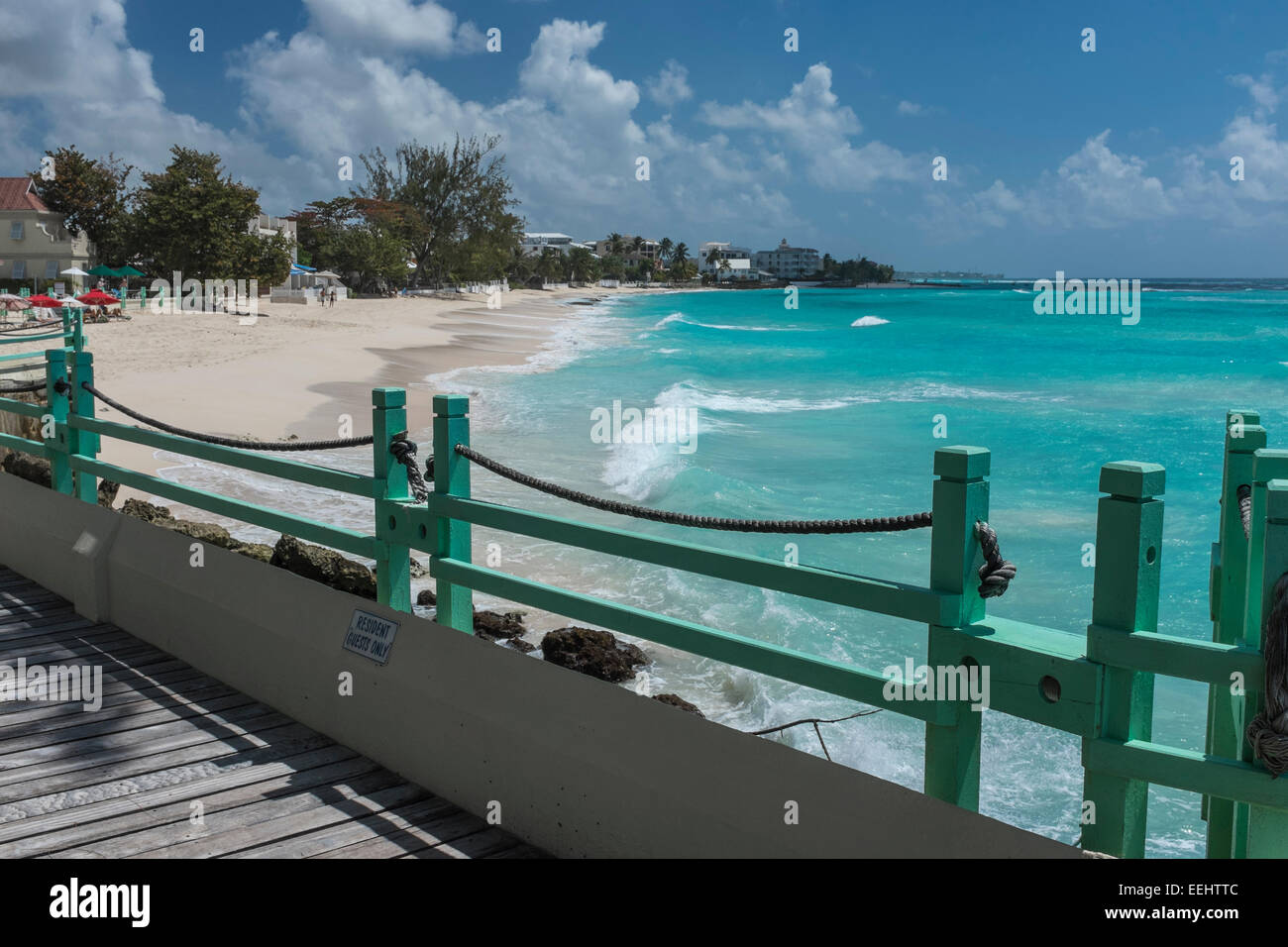 Wooden boardwalk at Worthing Beach on the south coast of the Caribbean island of Barbados, West Indies - EDITORIAL USE ONLY Stock Photo