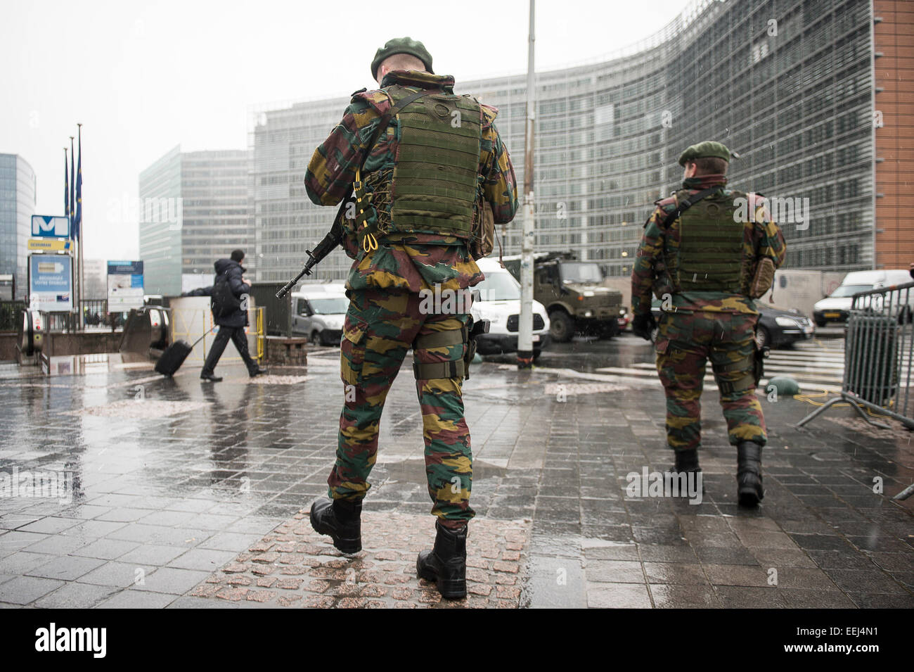 Brussels, Belgium. 19th Jan, 2015. Belgian soldiers stand on guard outside European Union headquarters in Brussels, Belgium on 19.01.2015 Belgian troops were deployed at sensitive sites in Brussels and Antwerp to upgrade security presence after a series of raids on suspected Islamic jihadists in various locations across Belgium with 13 arrests on Thursday evening and two people killed as part of a raid on a premise in the eastern town of Verviers. Another 150 troops will be deployed next week, as local media reports. Credit:  dpa picture alliance/Alamy Live News Stock Photo