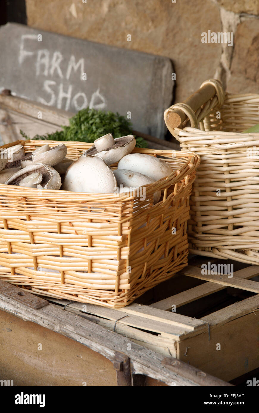Fresh produce for sale in baskets at a farm shop Stock Photo