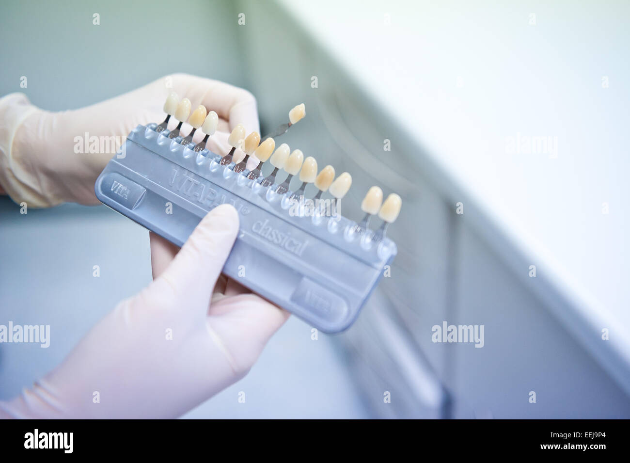 A dentists colour chart for crowns Stock Photo - Alamy