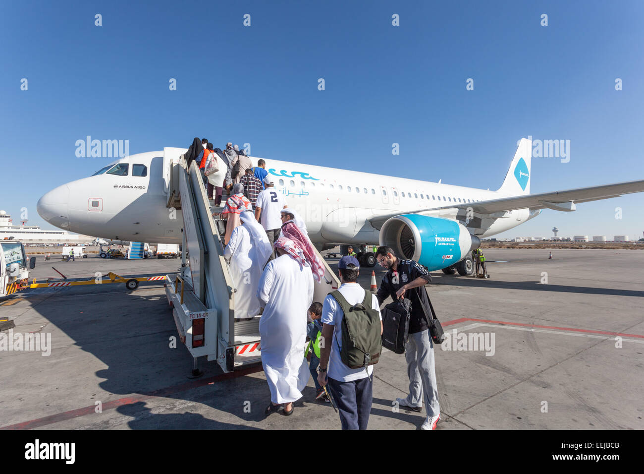 Jazeera Airways airplane boarding at the Kuwait International Airport. December 12, 2014 in Kuwait City, Middle East Stock Photo