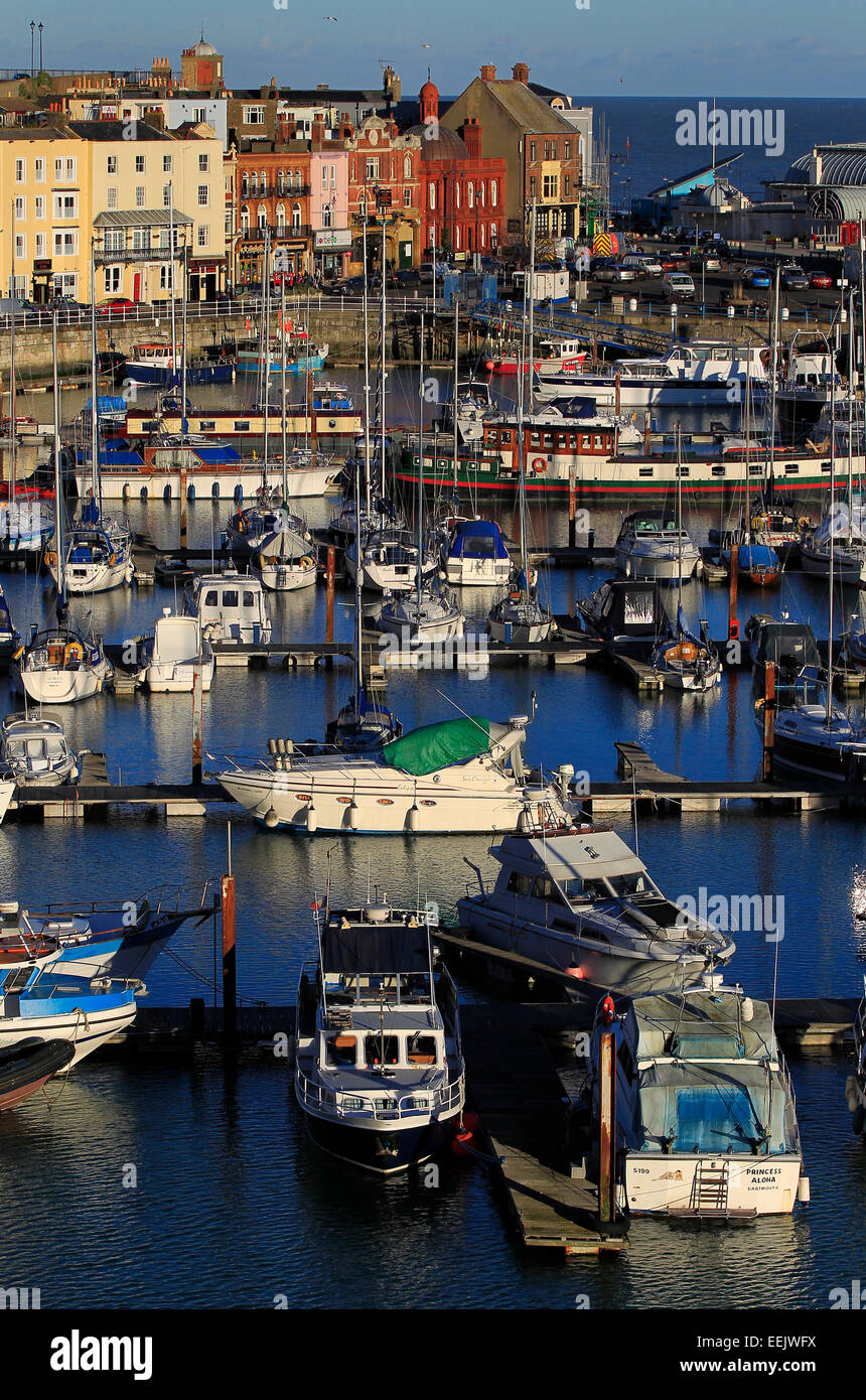 Boats and colourful buildings at the harbour at West Cliff, Ramsgate, Kent Stock Photo