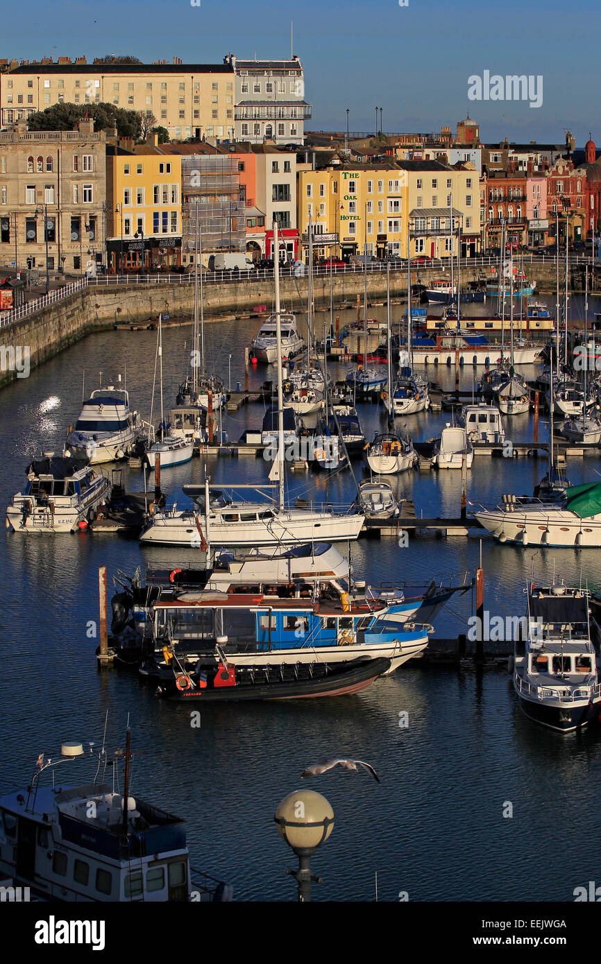 Boats and colourful buildings at the harbour at West Cliff, Ramsgate, Kent Stock Photo