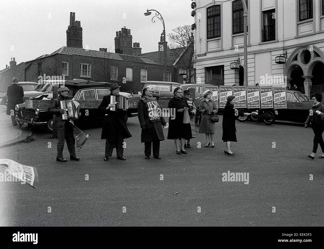 1950s historical picture showing a group of religious canvassers with signs at the start of the rowing race, the Oxford & Cambridge Boat Race, Putney, London. Stock Photo