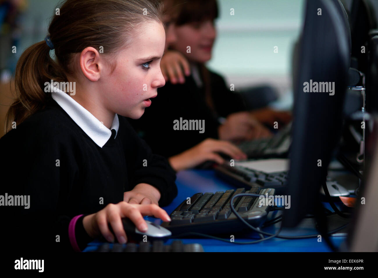 Girl in UK secondary school learning coding on computer Stock Photo