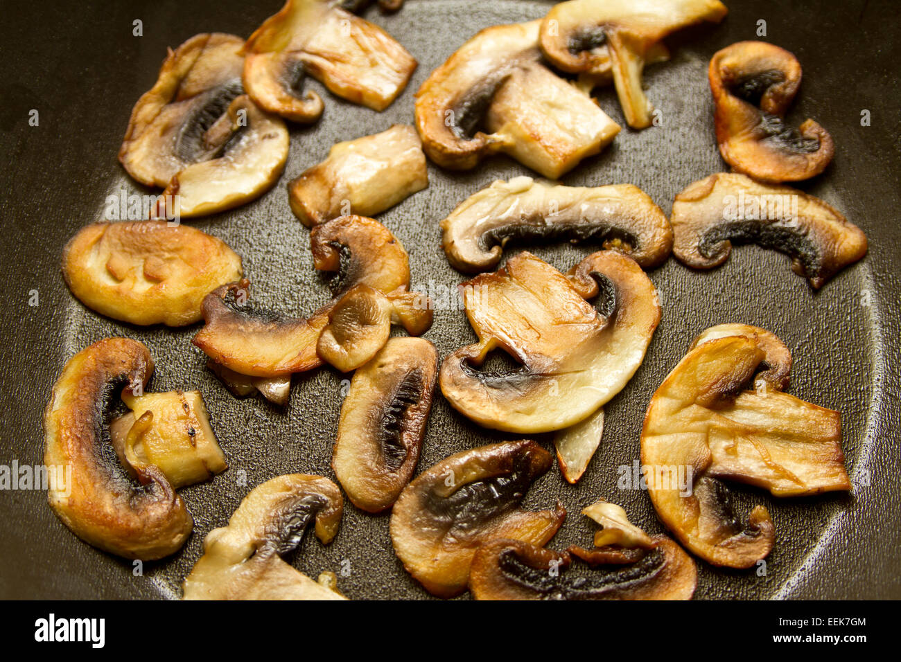 Fried mushrooms on a flying pan Stock Photo Alamy
