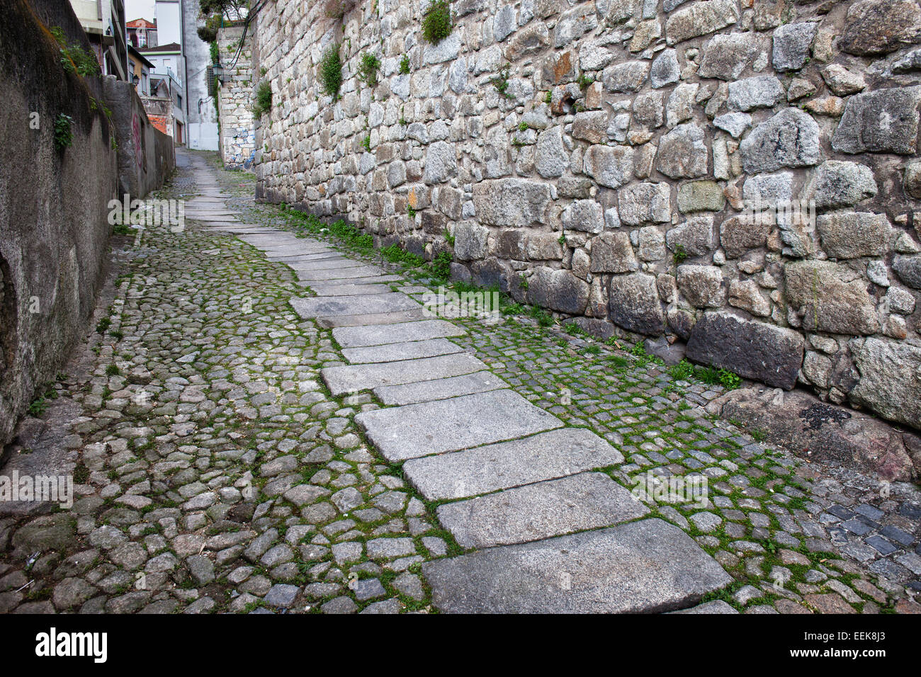Cobbled, ascending alley in the old city of Porto in Portugal. Stock Photo