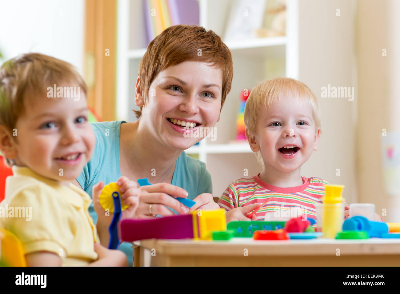 woman playing and teaching children Stock Photo