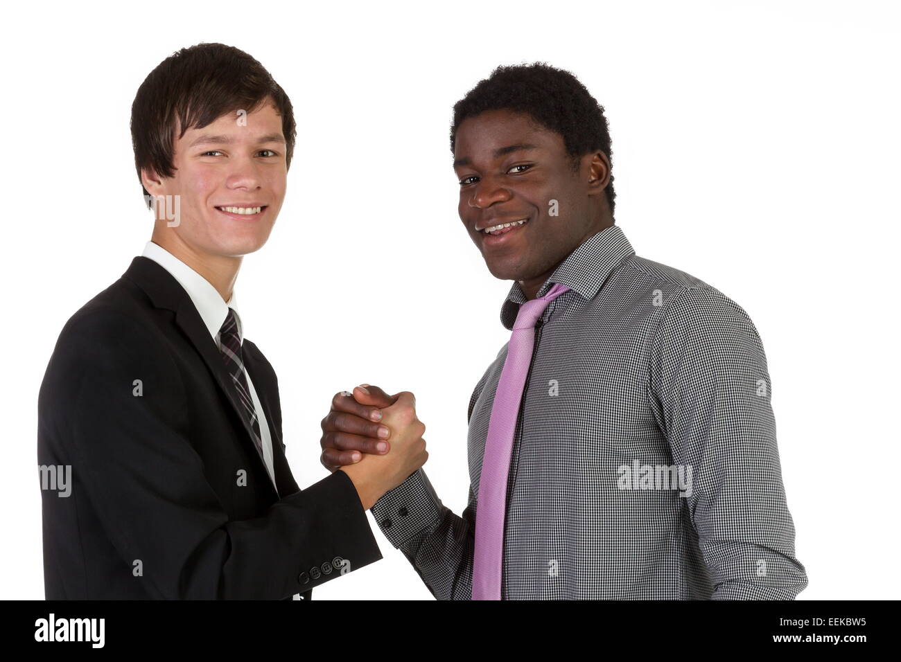 Young business partners shaking hands Stock Photo