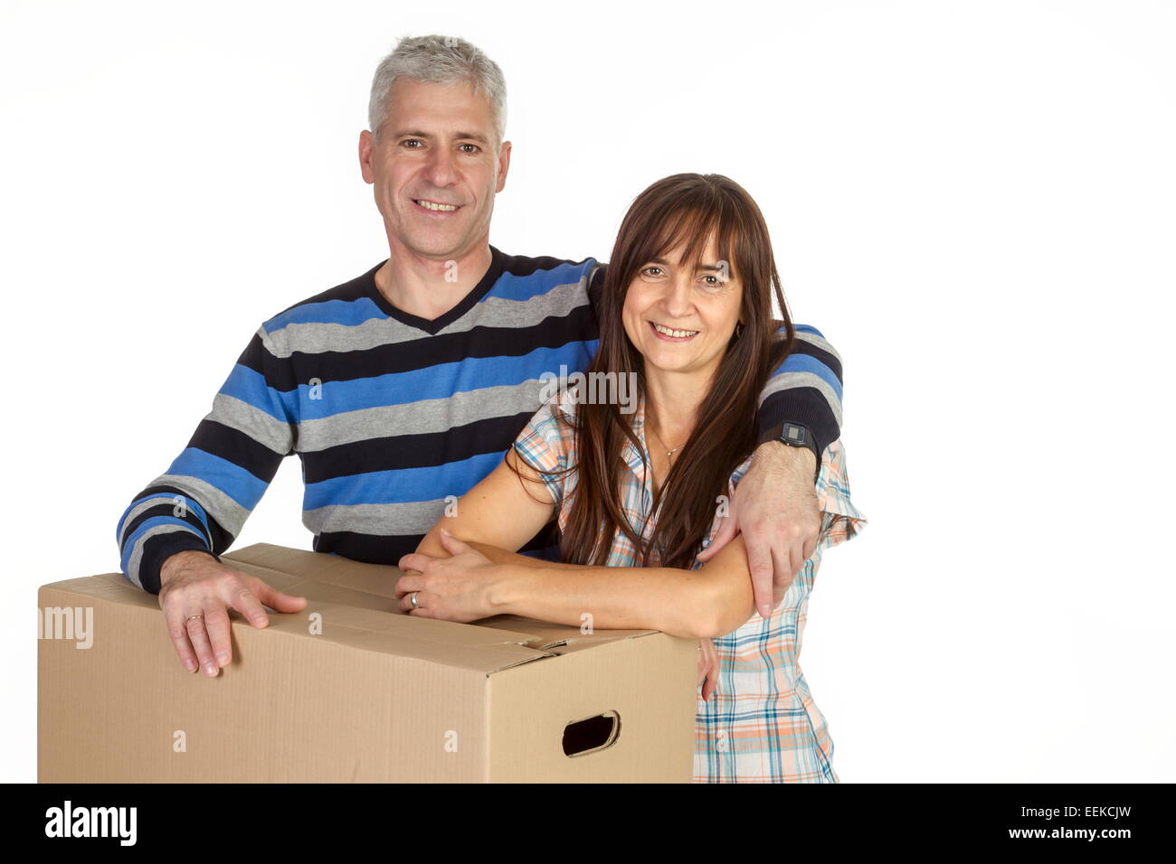 Paar mittleren Alters mit Umzugskartons, Middle-aged couple with removal boxes Stock Photo