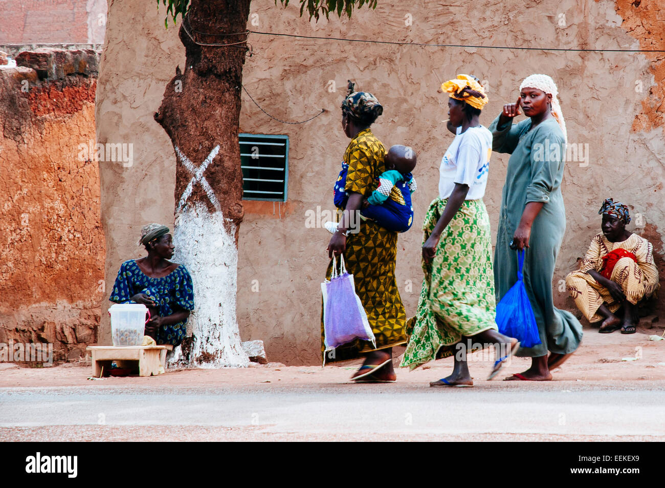 Women returning home from market. Bobo Dioulasso, Burkina Faso Stock Photo