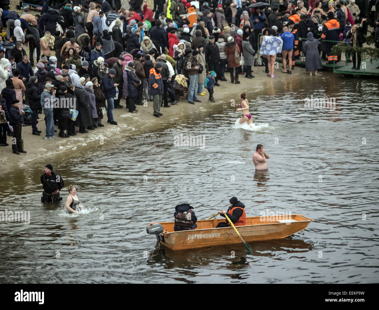 Rescuers watch the bathers. 19th Jan, 2015. -- 19 January, 2015, Kiev, Ukraine, great Christian holiday Epiphany. One of the main traditions of celebration - swimming in Jordan (the so-called consecrated priest hole). The current winter was unusually mild in Ukraine and swimming just held on the beach. Ukrainian Church of the Kiev Patriarchate traditionally celebrated in Gidropark © Igor Golovniov/ZUMA Wire/Alamy Live News Stock Photo