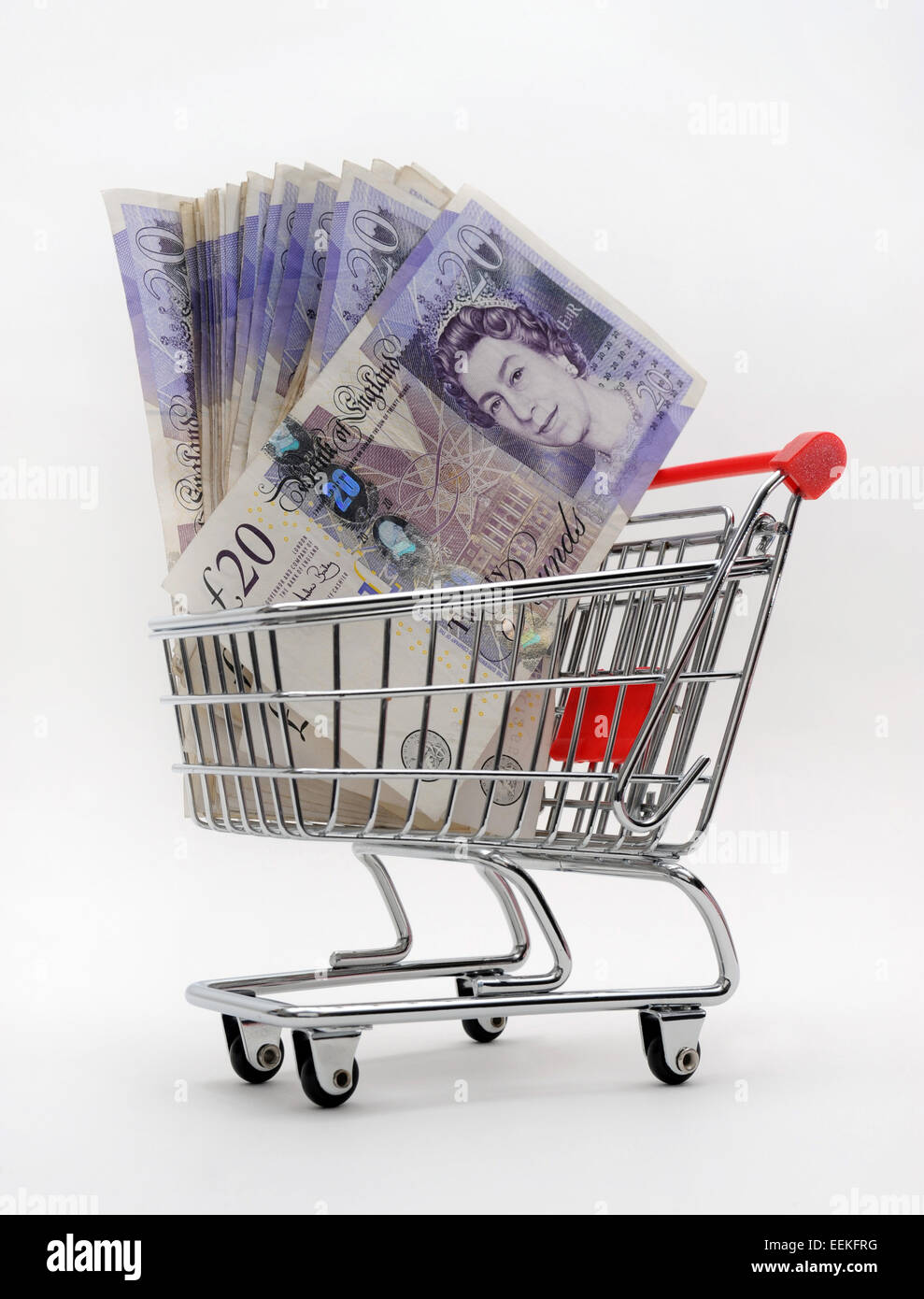 SUPERMARKET TROLLEY WITH £20 NOTES RE SUPERMARKETS FOOD PRICES COSTS HOUSEHOLD BUDGETS PENSION PROVIDER COMPANY SAVINGS CASH UK Stock Photo