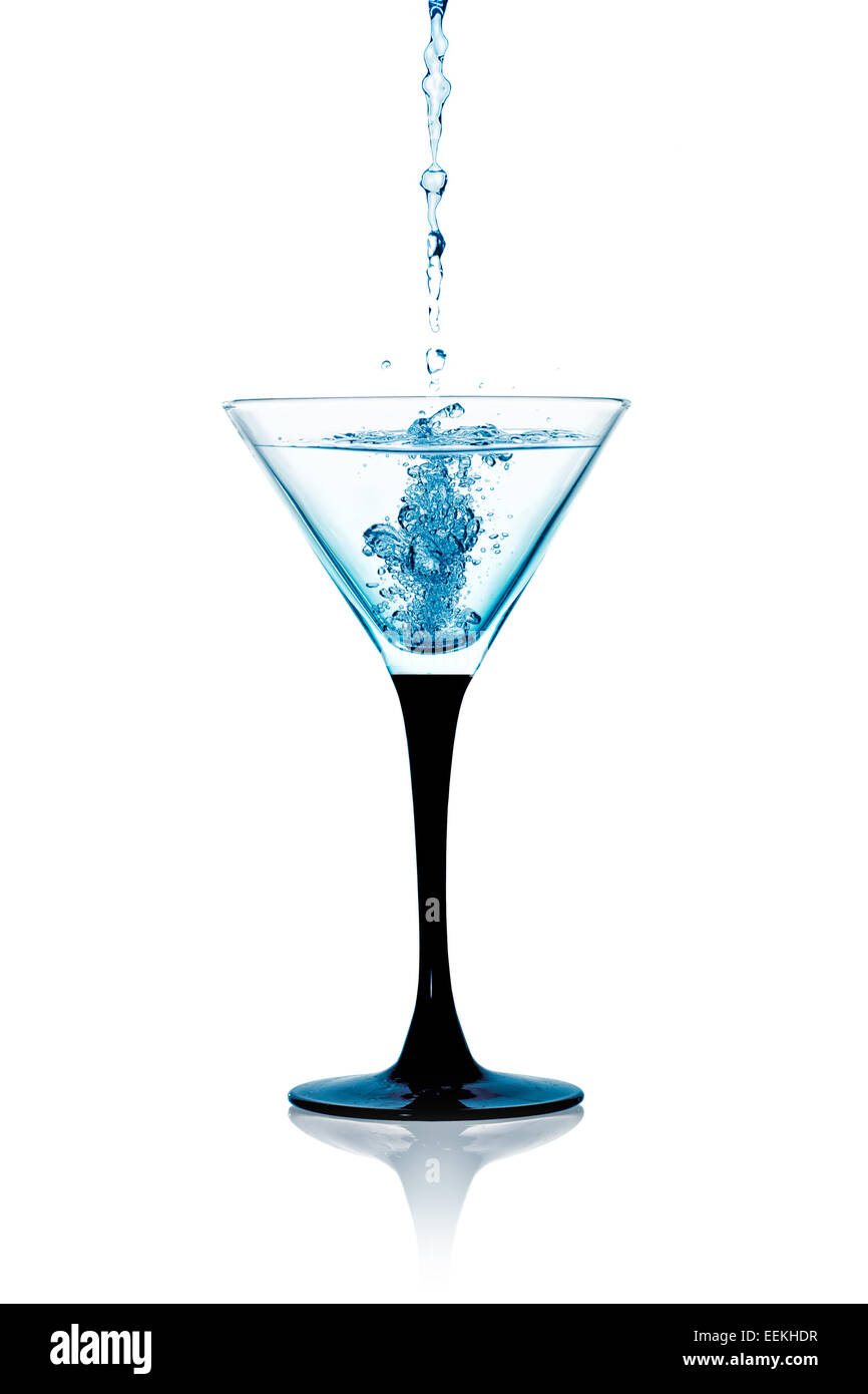 Liquor falling into a cocktail glass of dry martini. Gin cocktail isolated  on white background Stock Photo - Alamy