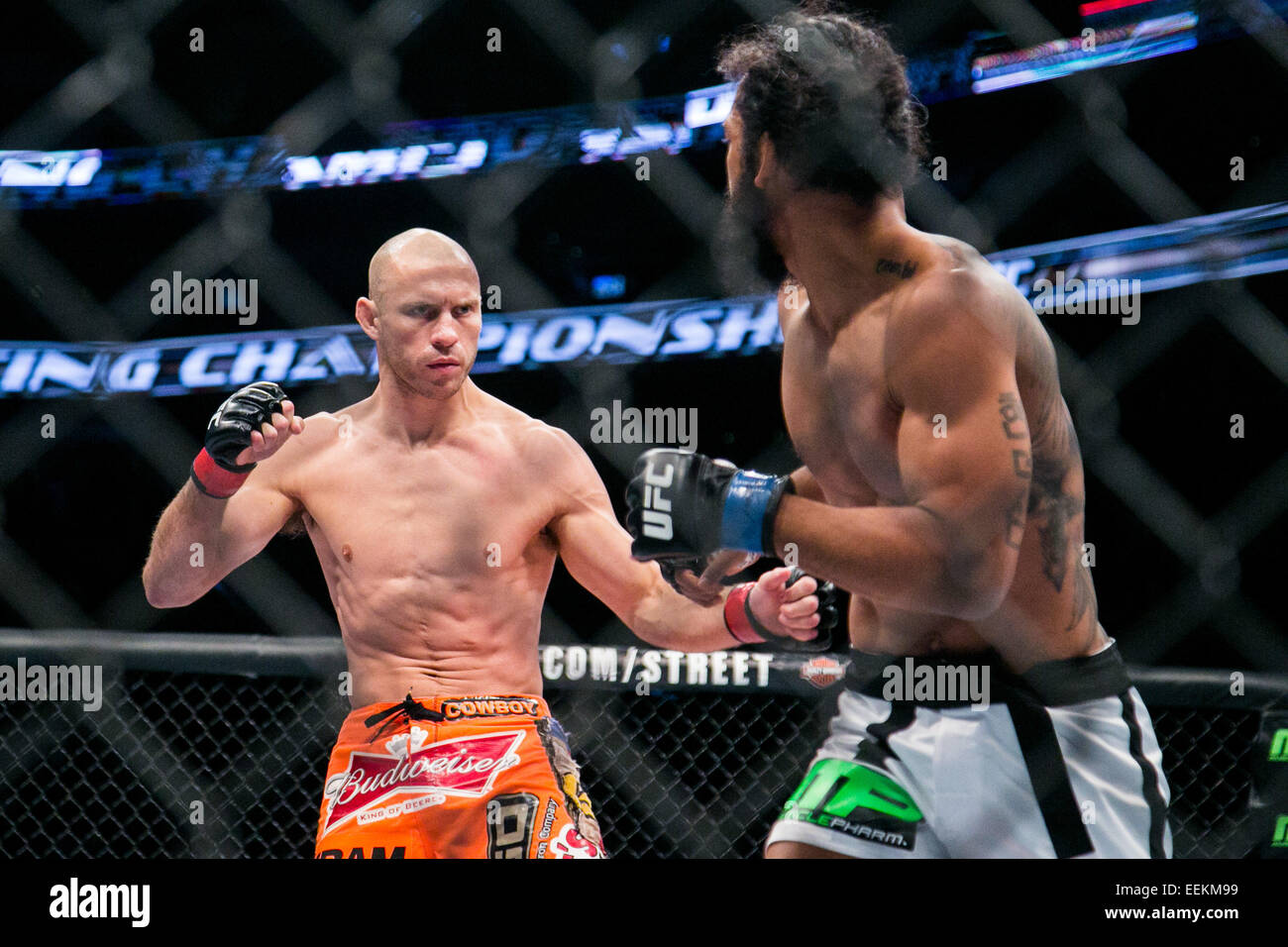 Boston, Mass. 18th Jan, 2015. 01/18/2015 -- BOSTON -- Lightweights Donald ''Cowboy'' Cerrone (orange trunks) and Benson ''Smooth'' Henderson (white trunks) fight in their main event fight at UFC Fight Night Boston at the TD Garden on Jan. 18, 2015. Cerrone won by unanimous decision. © Kelvin Ma/ZUMA Wire/Alamy Live News Stock Photo