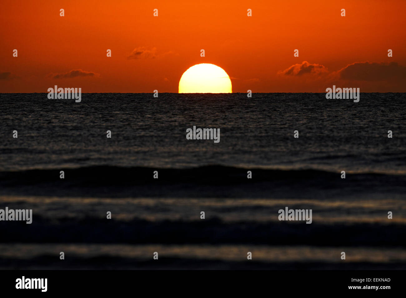 sun rising over the irish sea first thing in the morning Stock Photo