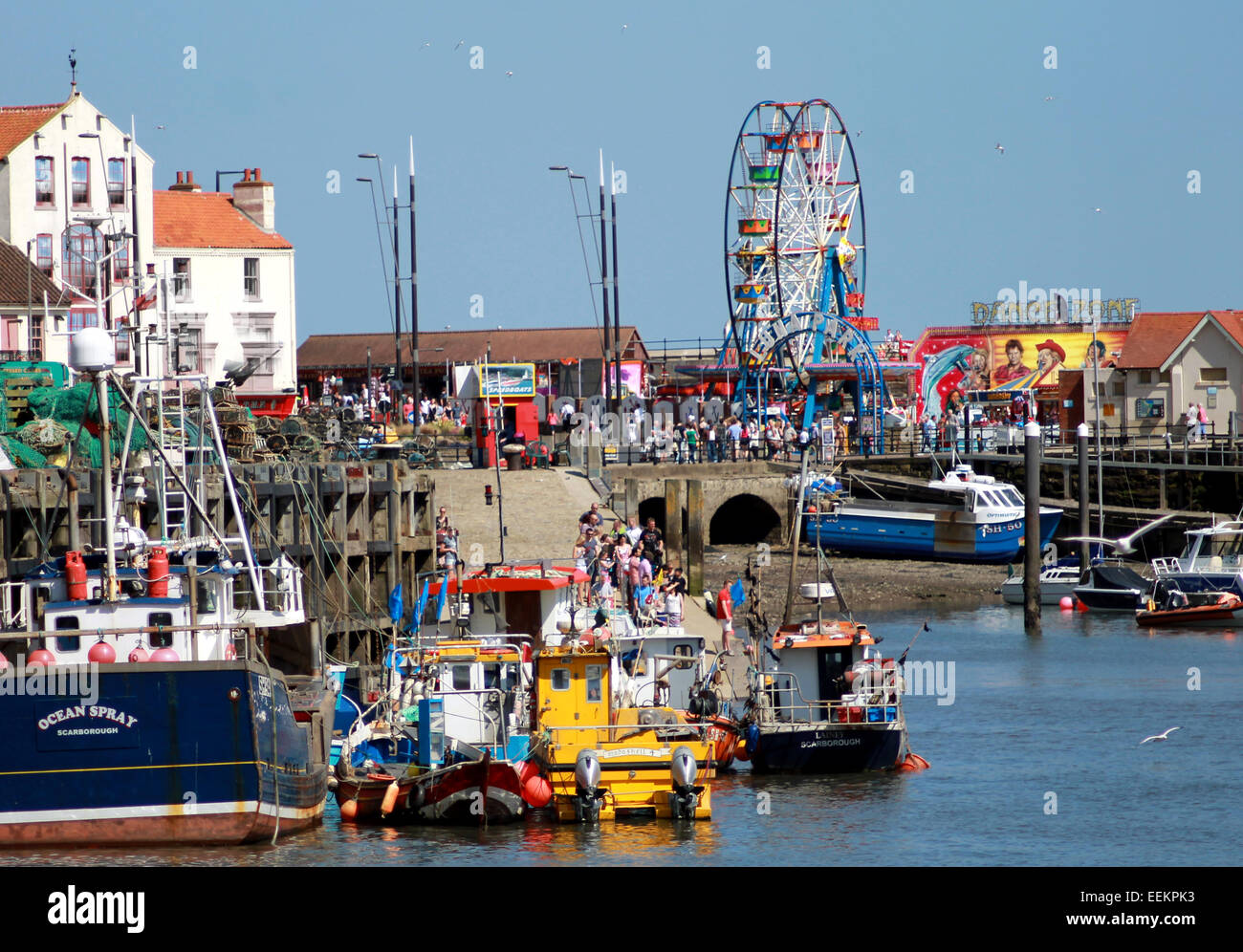 SCARBOROUGH, NORTH YORKSHIRE, ENGLAND - 19th May 2014: Scarborough harbor on the 19th of May 2014. This is a popular tourist des Stock Photo