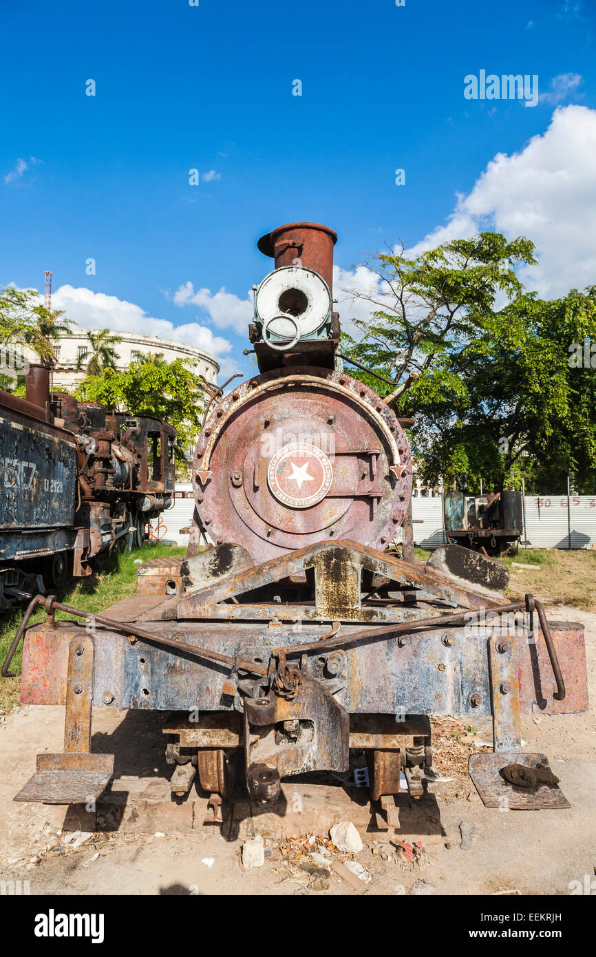 Dilapidated vintage rusty train from The Baldwin Locomotive Works, Philadelphia, USA in an urban scrapyard in downtown Old Havana, capital city ,Cuba Stock Photo