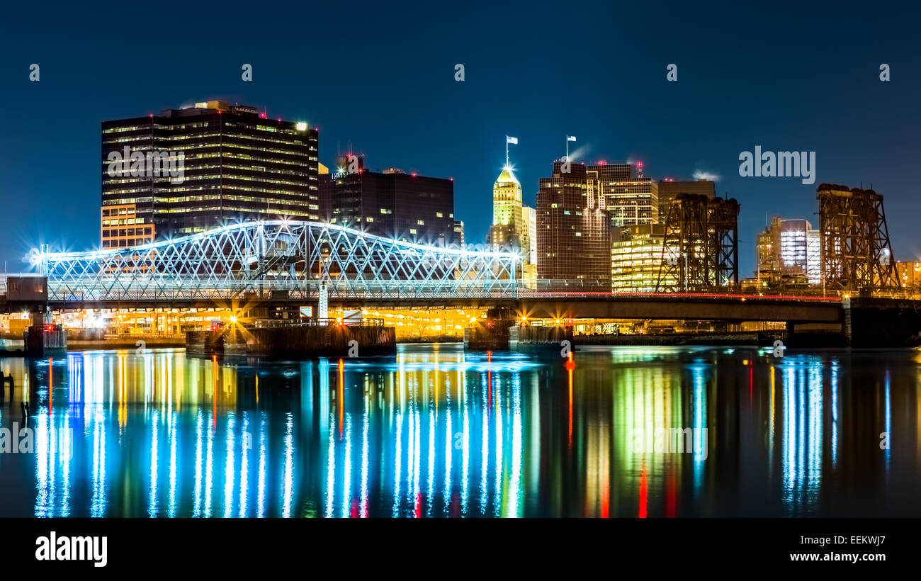 Newark, NJ cityscape by night, viewed from Riverbank park. Jackson street bridge, illuminated, spans the Passaic River Stock Photo