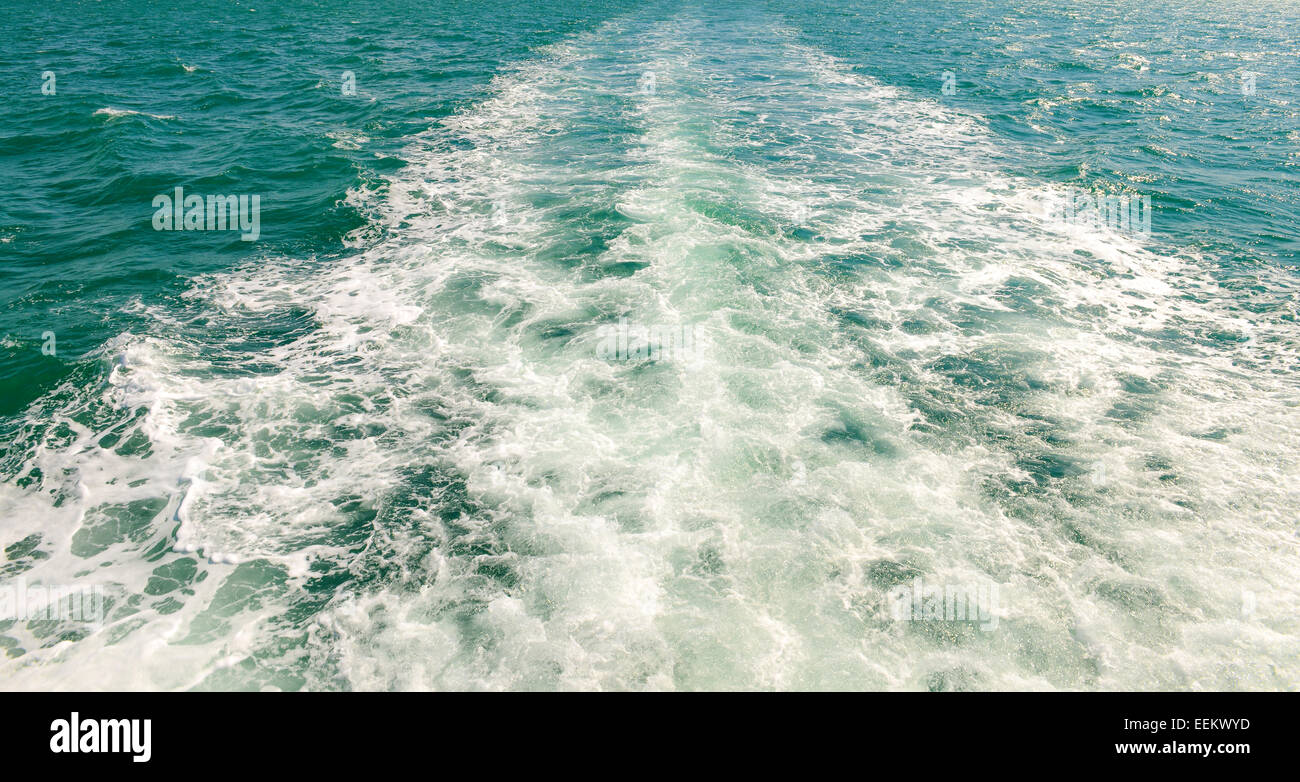 The wake of a boat as seen from the stern of a ship. Stock Photo