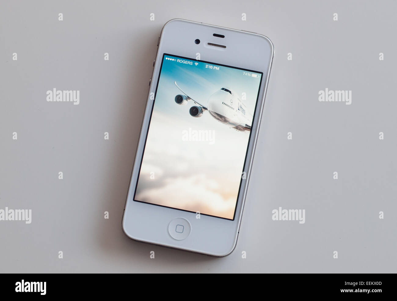A view of the homescreen of the Lufthansa mobile app on a white Apple iPhone 4. Stock Photo