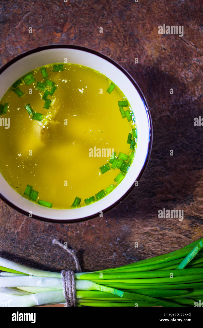 Chicken broth soup with herbs Stock Photo