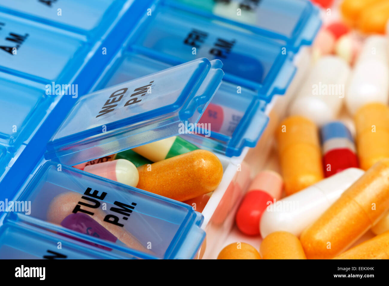 Nurse Preparing Weekly Pill Organizer Stock Photo - Download Image
