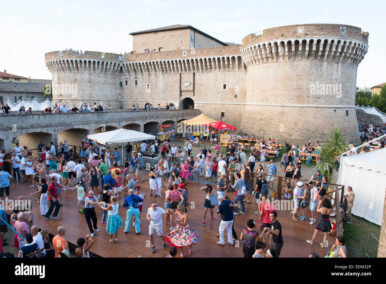 People dancing in the festival grounds in front of Fortress Rocca Roveresca, Summer Jamboree, Rock 'n' Roll Festival, Senigallia Stock Photo